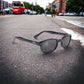 The 2010 KD's sunglasses worn by SAMCRO in Sons of Anarchy with smoked lenses placed on the road in the street.