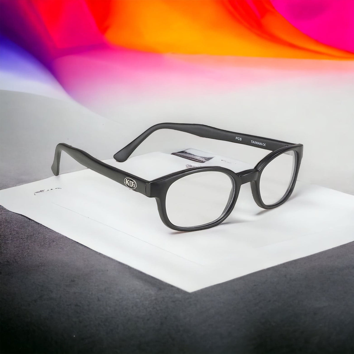 The X-KD's 10015 large sunglasses with transparent polycarbonate lenses and a matte black frame exposed in front of a aurora borealis.